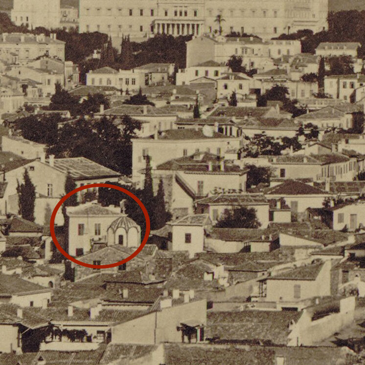 A view of Athens where we see the west side of the building behind the church of Agion Apostolon (http://1874_athens-detail_moraites_gallica.bnf.fr/).